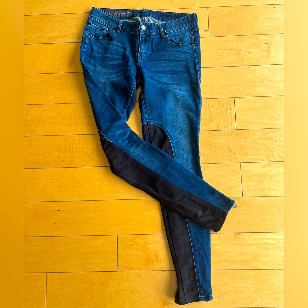 ARMANI EXCHANGE jeans with black suede accents.